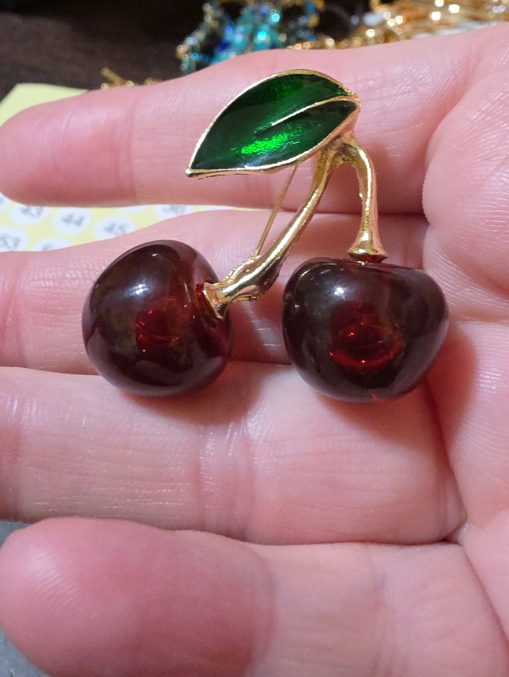 A189- Gold-Tone Cherry Pin Brooch with Green Enamel Leaf